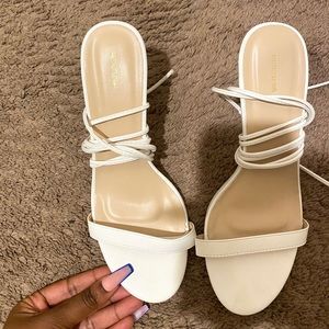 White PRETTYLITTLETHING heels.